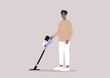 A male African character cleaning with a cordless vacuum cleaner, household chores