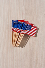 Pack Of Small American Flags On A Table
