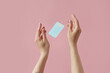 © Yaroslav Danylchenko/Stocksy - Woman catching credit card