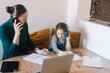 © Alberto Bogo/Stocksy - Mother Making Business Calls And Child Copying Her