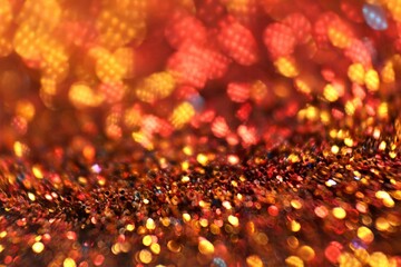 Sticker - Christmas background. Glowing bokeh. Shining background.Shiny Festive Background. gold glitter texture..Beautiful bokeh background in gold colors.Glowing bokeh.