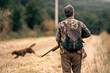 © Santi Nuñez/Stocksy - Back view of a hunter man looking for prey
