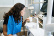 © Mal de Ojo Studio/Stocksy - Woman at the dentist sipping water