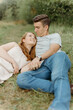 © Luke Liable/Stocksy - Couple laughing together on the ground