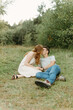 © Luke Liable/Stocksy - Couple kissing together on the ground