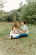 © Luke Liable/Stocksy - Couple laughing together on the ground
