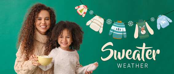 Poster - Little African-American girl and her mother in warm sweaters and with cup of hot chocolate on green background