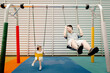 © Rein Cheng/Stocksy - Asian baby and dad swinging