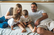 © Aleksandra Jankovic/Stocksy - Family Of Four Using The Phone