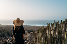 Woman In Hat On Seashore