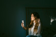 © Eloisa Ramos/Stocksy - Beautiful teen woman using her phone
