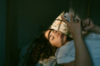 © Eloisa Ramos/Stocksy - Teen girl with her phone on the bed
