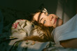 © Eloisa Ramos/Stocksy - Teen girl lying on the bed