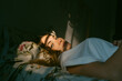 © Eloisa Ramos/Stocksy - Teen woman good looking lying on her bed