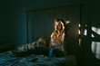 © Eloisa Ramos/Stocksy - Beautiful teen girl sitting on the bed