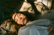 © Eloisa Ramos/Stocksy - Beautiful woman sleeping at dawn