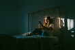 © Eloisa Ramos/Stocksy - Beautiful teenager woman using her phone at bedroom