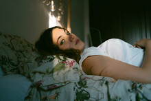 Teen Woman Lying On The Bed