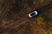 White Car On A Dusty Road, Drone Shot From Above