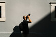 © Ezequiel Giménez/Stocksy - Photographer taking pictures of building