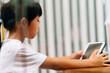 © Pansfun Images/Stocksy - Asian little girl uses a tablet pc