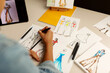 © Valentina Barreto/Stocksy - Designing fashion sketches on paper