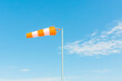 © Jeongho Byeon/Stocksy - Stripe wind direction flag.