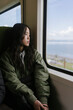 © Mattia/Stocksy - Asian woman commuter on the Train
