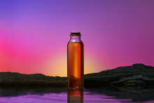 Tea Bottle In Front Of A SunSet