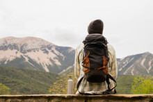 Backpacker Overlooking The Mountain Range