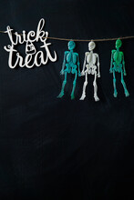    Trick Or Treat Sign Colored Skeletons Hanging