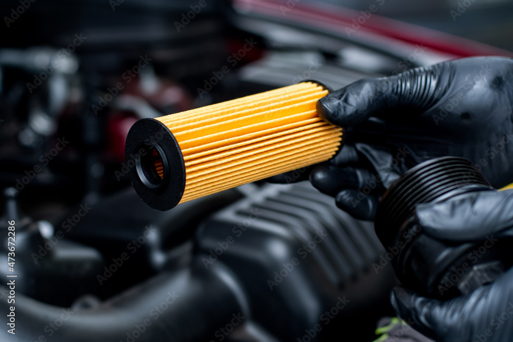 Changing car oil filter. DIY change engine motor oil. At home vehicle ...