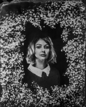 Blonde Woman Framed With Baby's Breath.