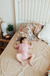 © Brat Co/Stocksy - Baby In Bed