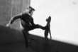 © Maryanne Gobble/Stocksy - Urban Kid Jumping and Kicking a Cement Wall