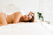 © Nuria Seguí/Stocksy - Young Woman Relaxing In Bed