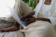 © Tanya Yatsenko/Stocksy - A young  black woman using a laptop computer