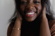 © Tanya Yatsenko/Stocksy - Laughing woman closeup