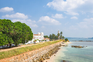 Wall Mural - Galle town shoreline leading to lighthouse on Sri Lanka island