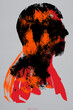 © The Laundry Room/Stocksy - Male Head Profile with Black Orange and Red Ink