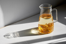Closeup Of Perfume Lotus Tea In Glass Jug