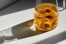 Closeup Of Perfume Lotus Tea In Glass Jug