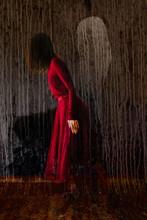 Woman In Red With Ghost Image In Background