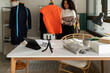 © Valentina Barreto/Stocksy - Woman showing clothes online