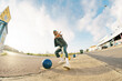 © Javier Díez/Stocksy - Cool black man reaching hand to camera on parking lot
