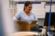 © Raymond Forbes Photography/Stocksy - Shipping worker at warehouse