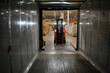 © Raymond Forbes Photography/Stocksy - Man Loading tractor trailer truck at warehouse