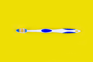 toothbrush on a yellow background top view