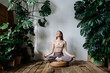 © Sergey Narevskih/Stocksy - Woman meditating during yoga session