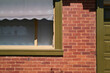 © Rowena Naylor/Stocksy - Brick home with sunshade